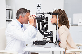 Doctor Performing a LASIK Exam on a Patient