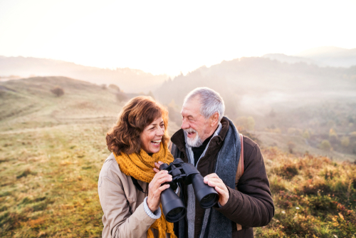 Older Man and Woman Looking Through Binoculars