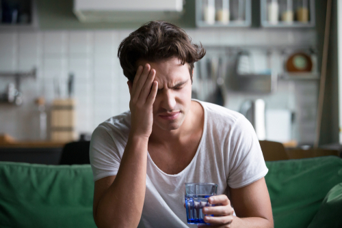 Young man suffering from dry eyes