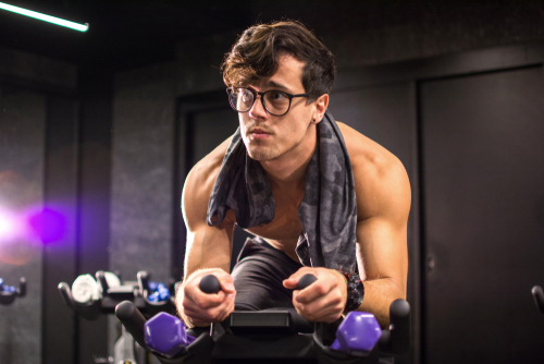 Man with eyeglasses exercising 