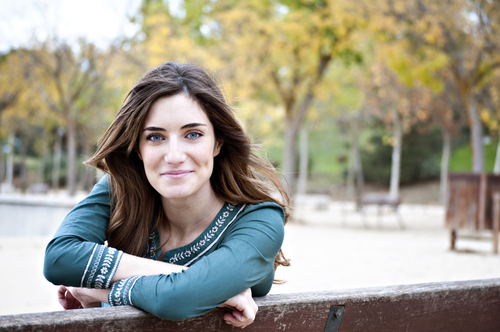 Woman looking over bench in Autumn