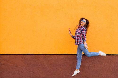 Woman jumping with bright background