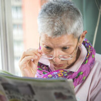 Woman reading with glasses